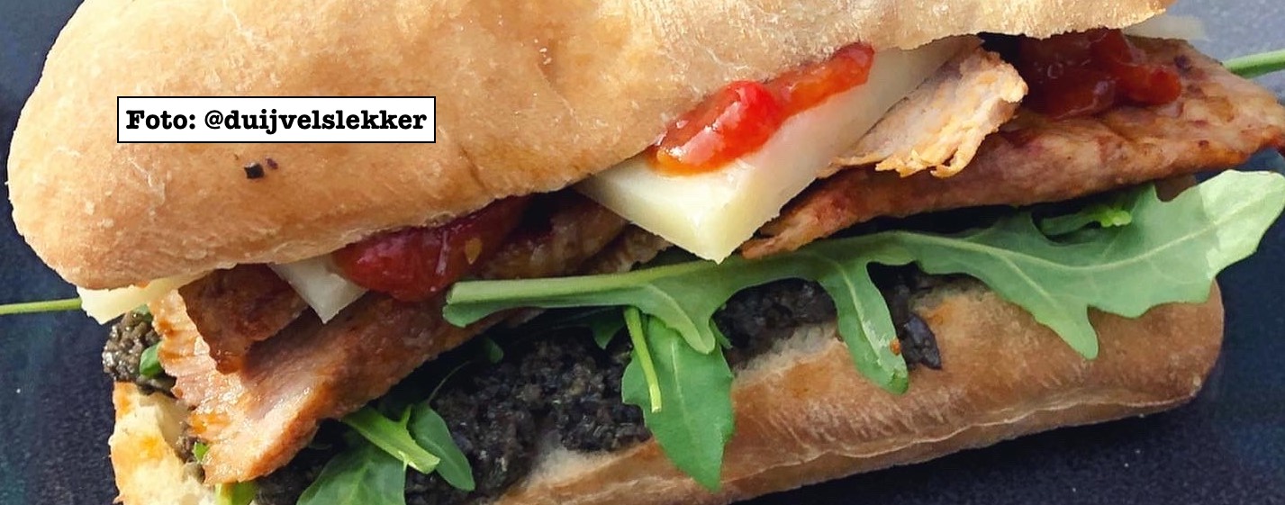 Secreto sandwich with black olive tapenade and Manchego