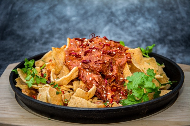 Cassava chips with rendang, spicy Cheddar and chili sauce