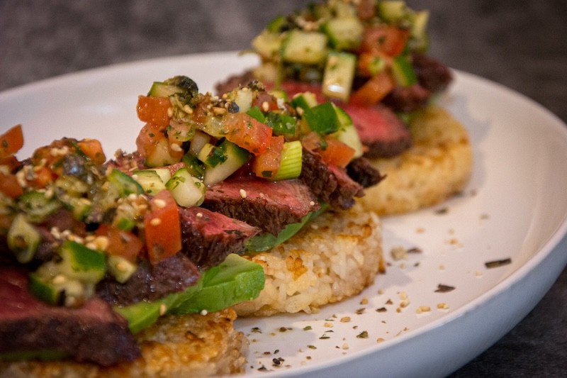 Crispy rice cakes with Wagyu hanger steak, avocado and furikake
