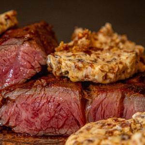Chuck eye steak with chorizo and sun dried tomato butter