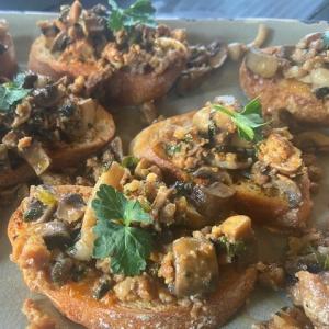 Mushroom crostini with sausages