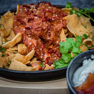 Cassava chips with rendang, spicy Cheddar and chili sauce