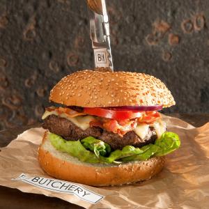 Wagyu burger with cheddar and bacon on a brioche bun