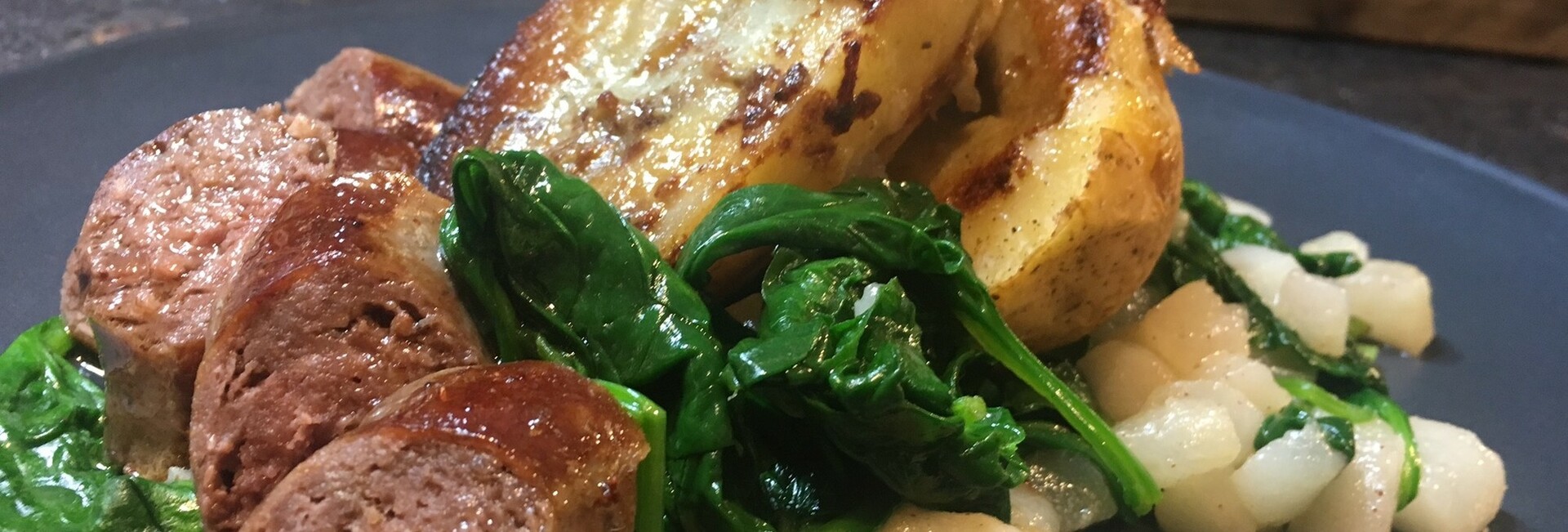 Livar sausage with spinach-pear salad and baked potato